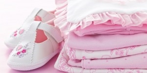 Pink infant girl clothing and shoes for baby shower